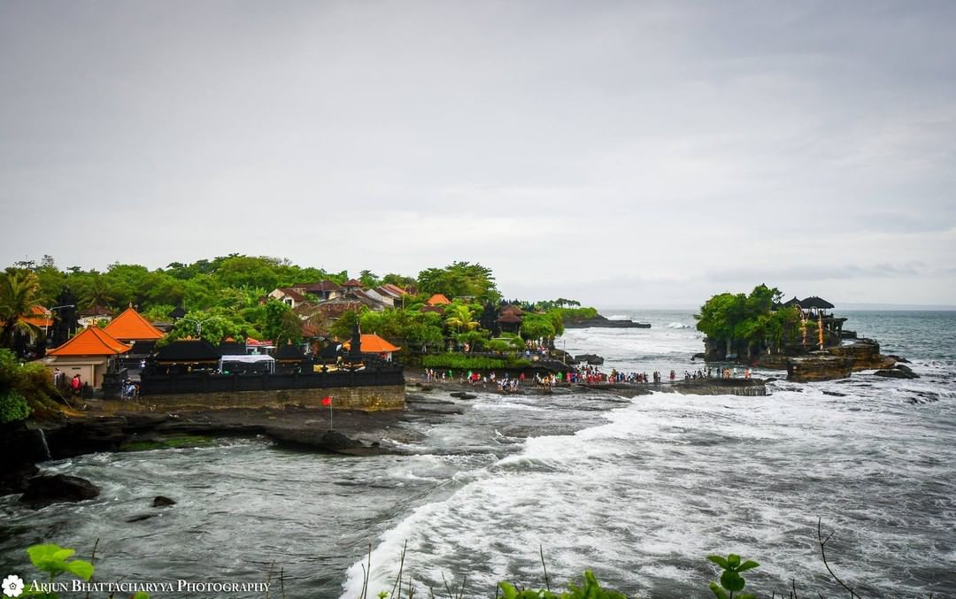 Tanah Lot temples in Bali, Indonesia 
Tanah Lot is a rock formation off the Indo…